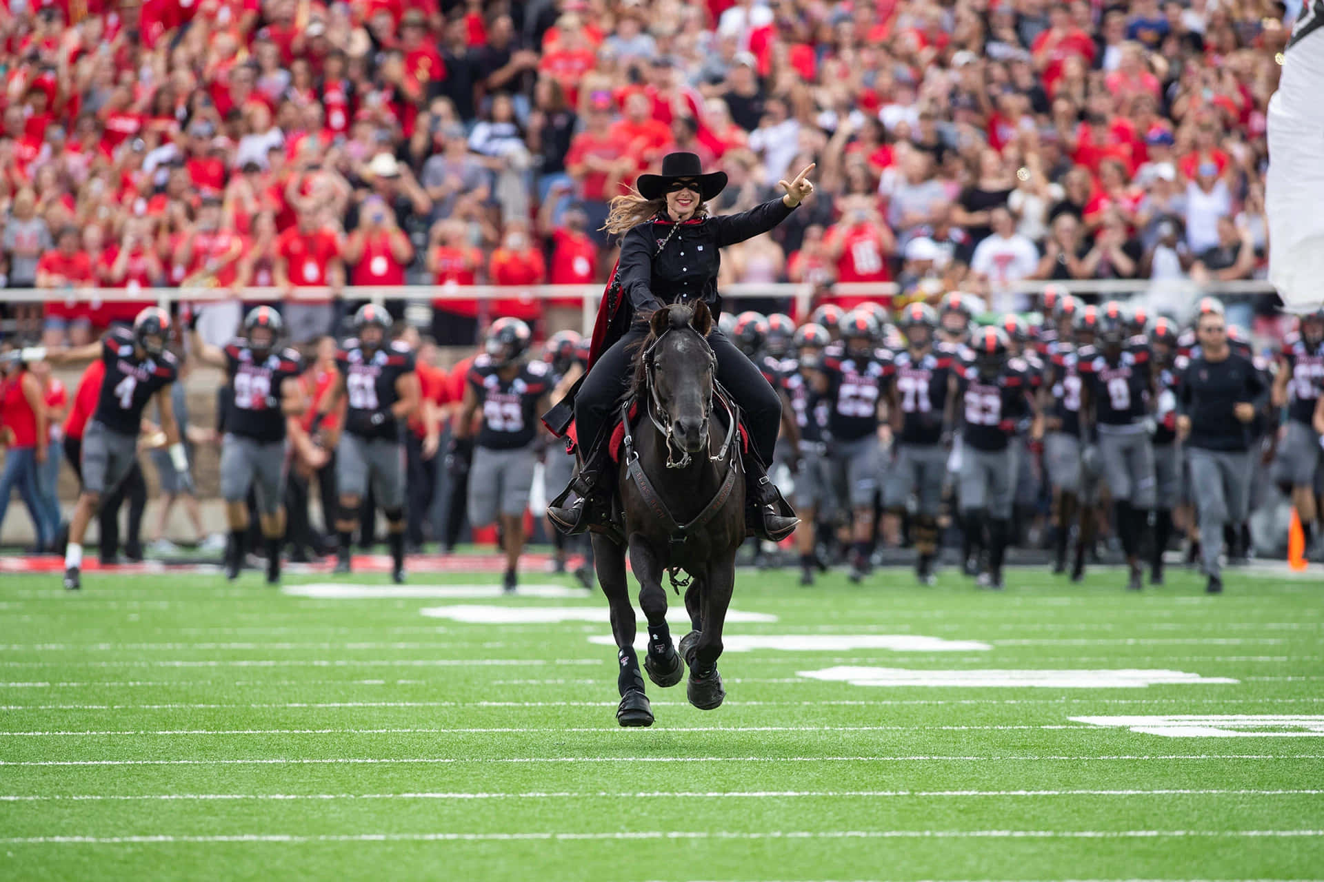 A Man Riding A Horse Background