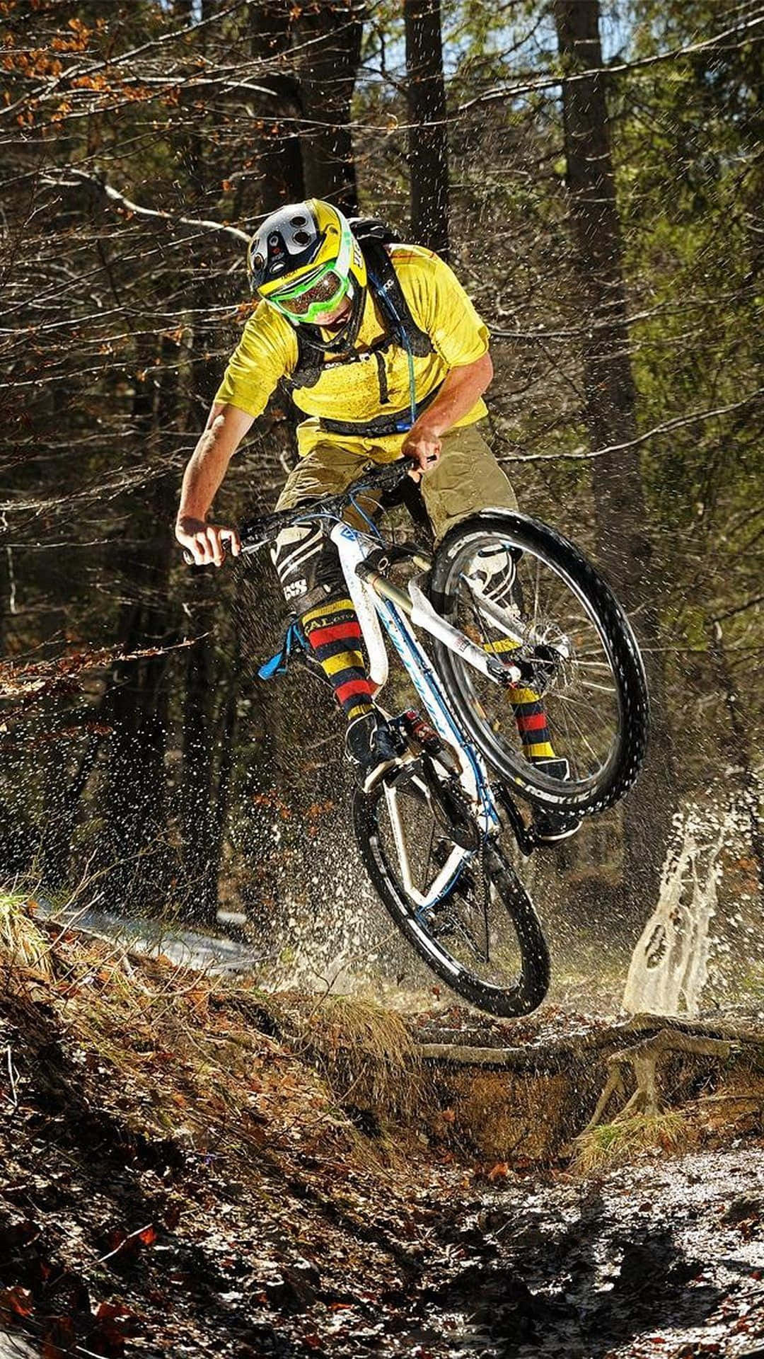 A Man Riding A Mountain Bike Background