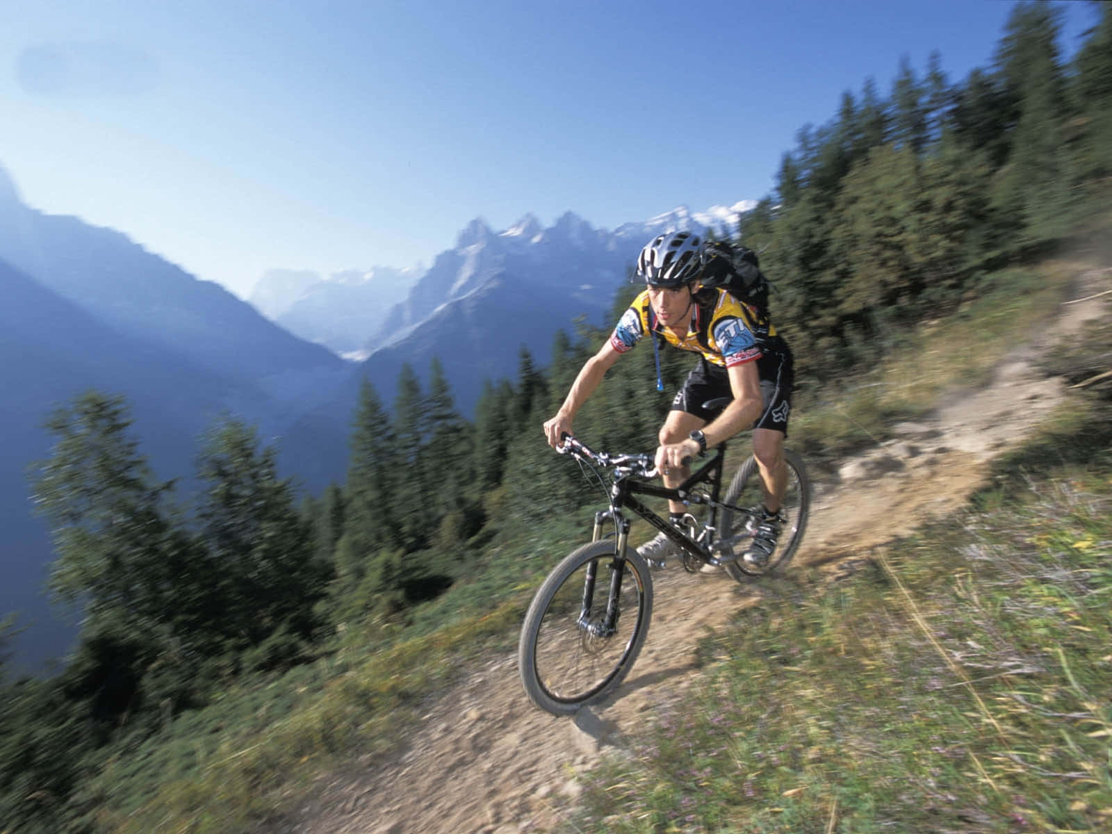 A Man Riding A Mountain Bike
