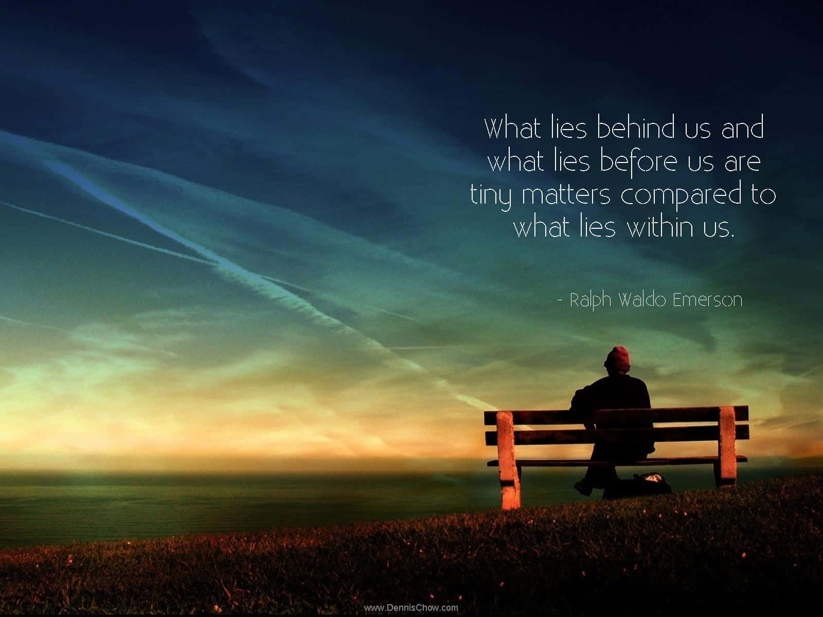 A Man Sitting On A Bench With A Quote Background