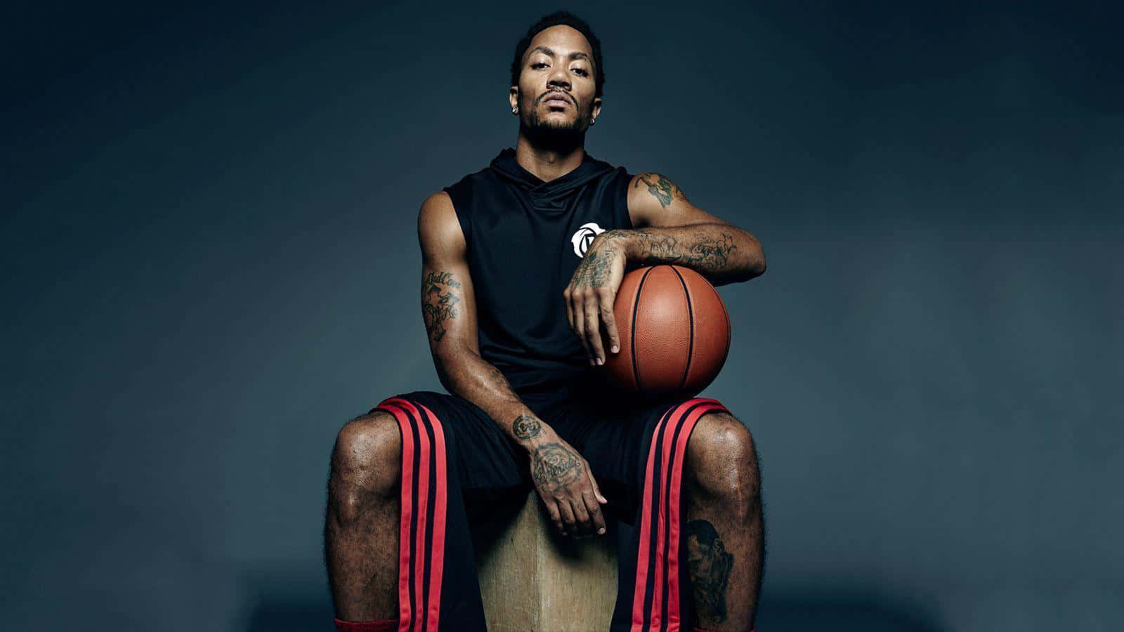 A Man Sitting On A Box Holding A Basketball