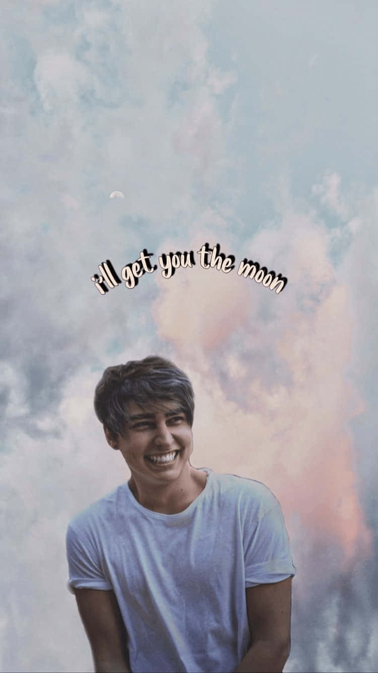 A Man Smiling With The Words'all Got You The Moon' Background