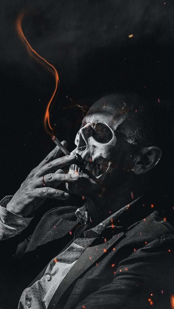 A Man Smoking A Cigarette In A Dark Room Background