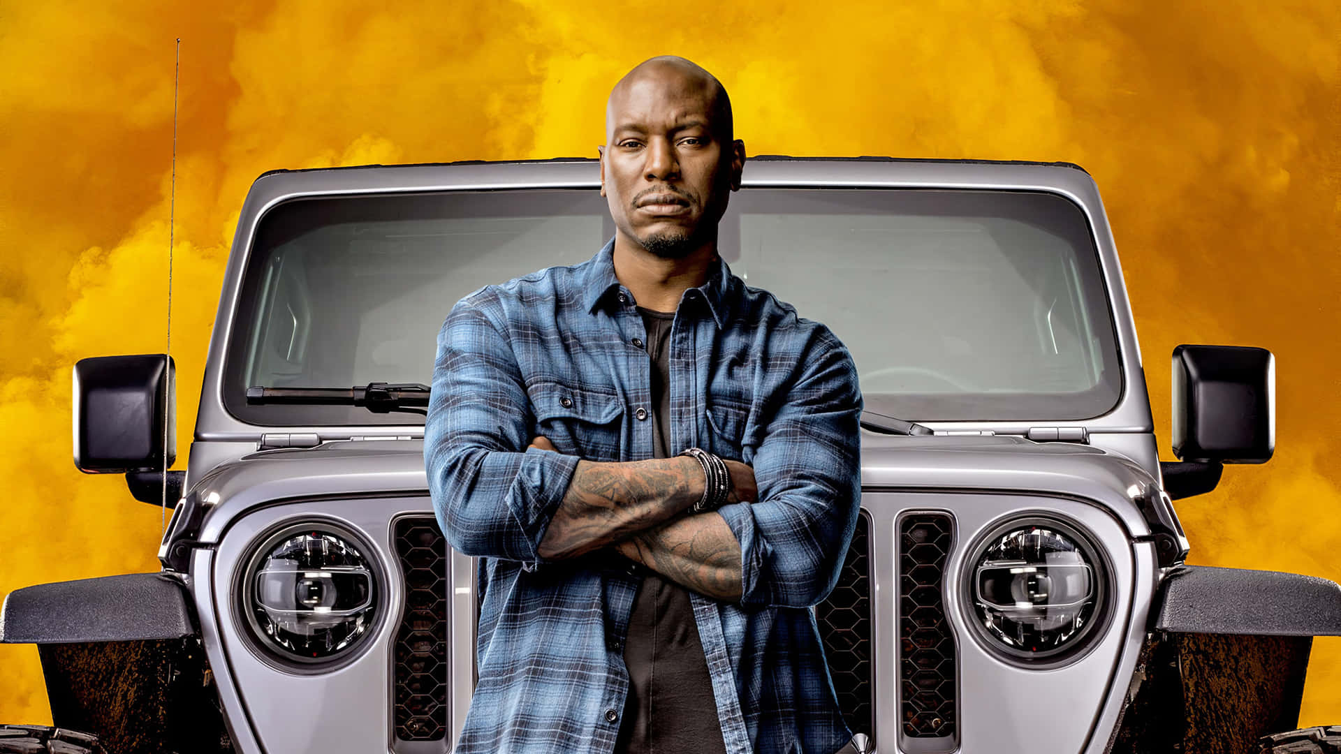 A Man Standing Next To A Jeep With Smoke Coming Out Of It Background