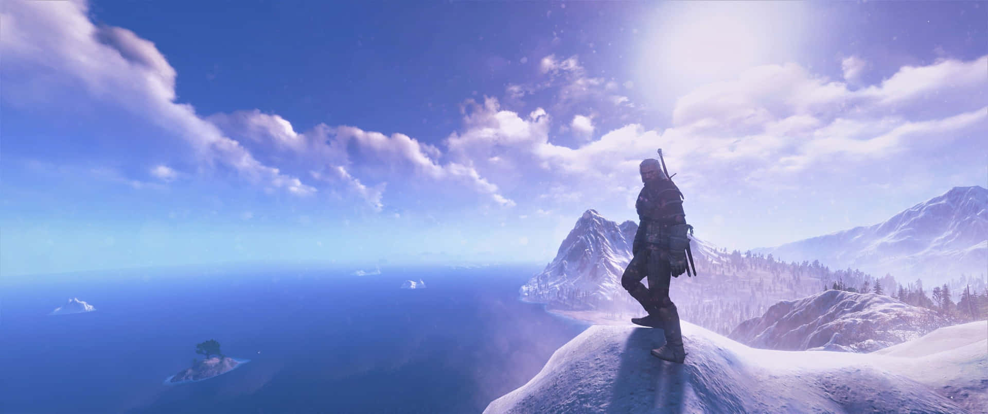 A Man Standing On A Mountain Top Looking At The Ocean
