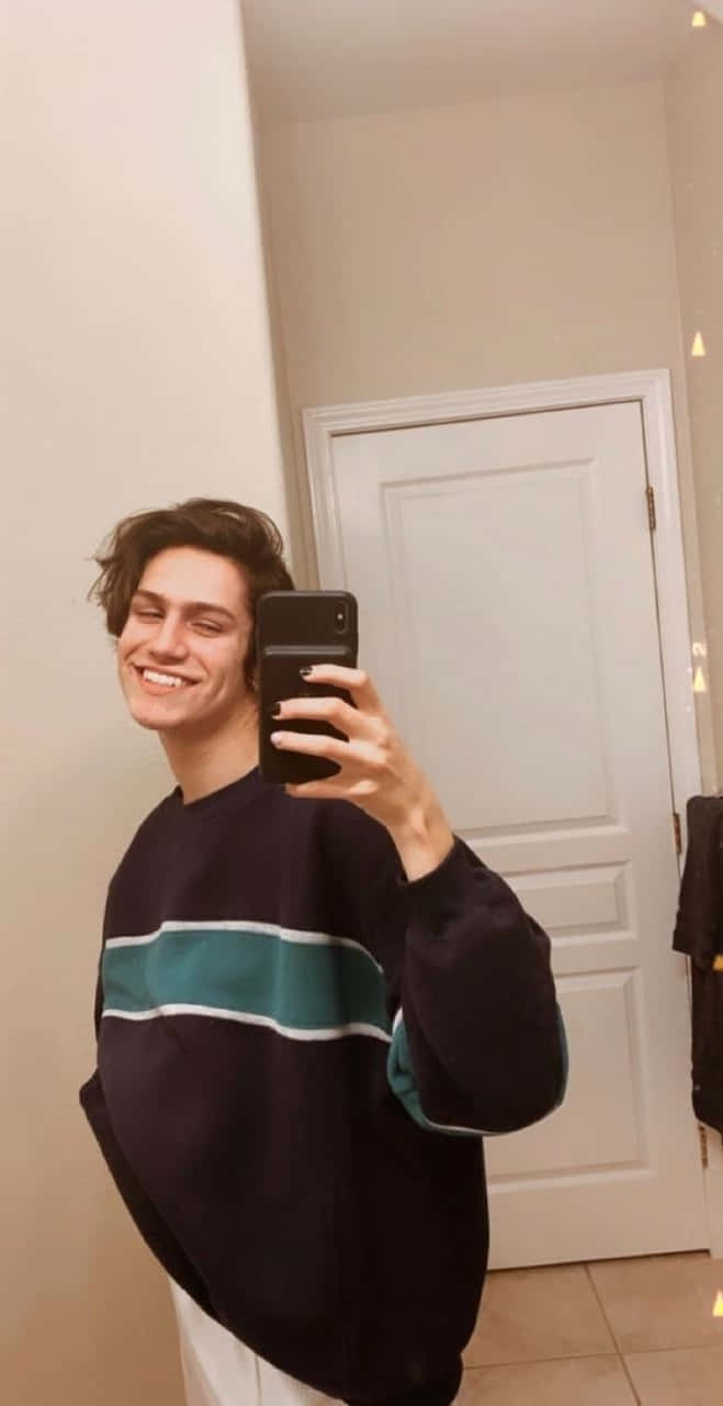 A Man Taking A Selfie In A Bathroom