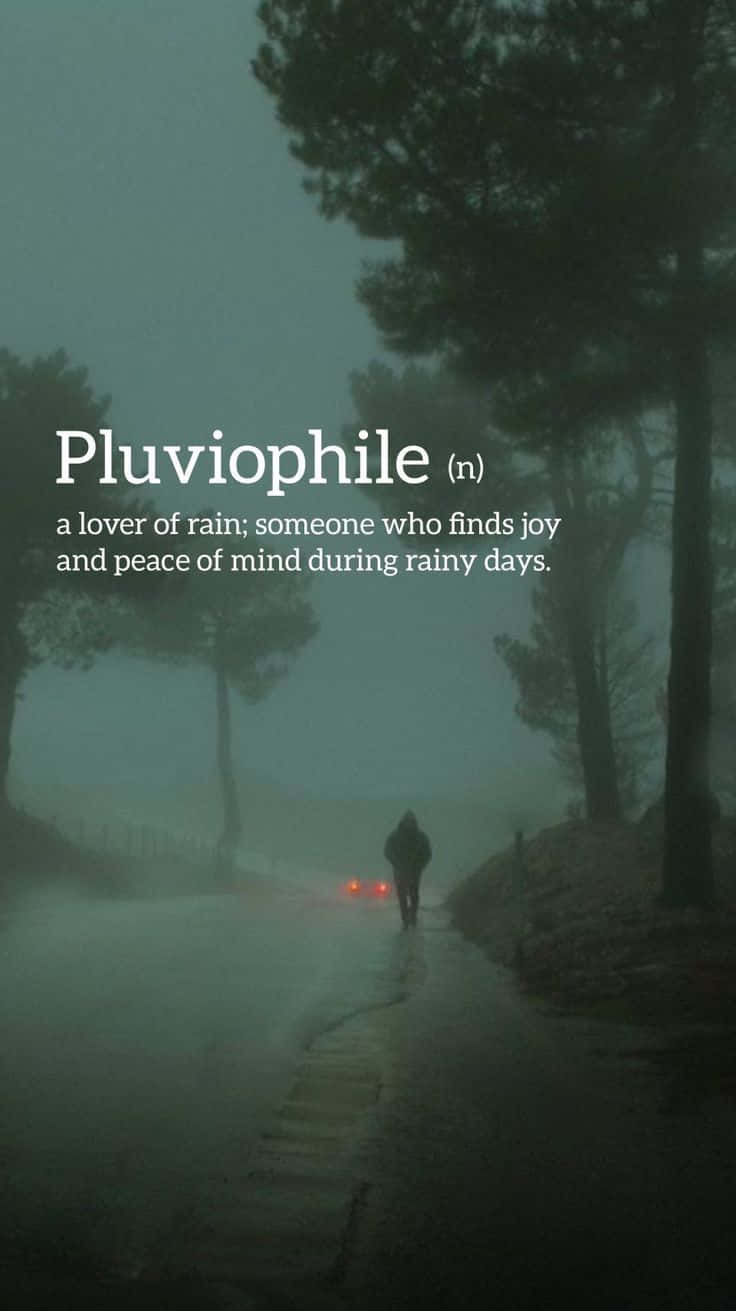 A Man Walking Down A Street With The Words Pluvophile Background
