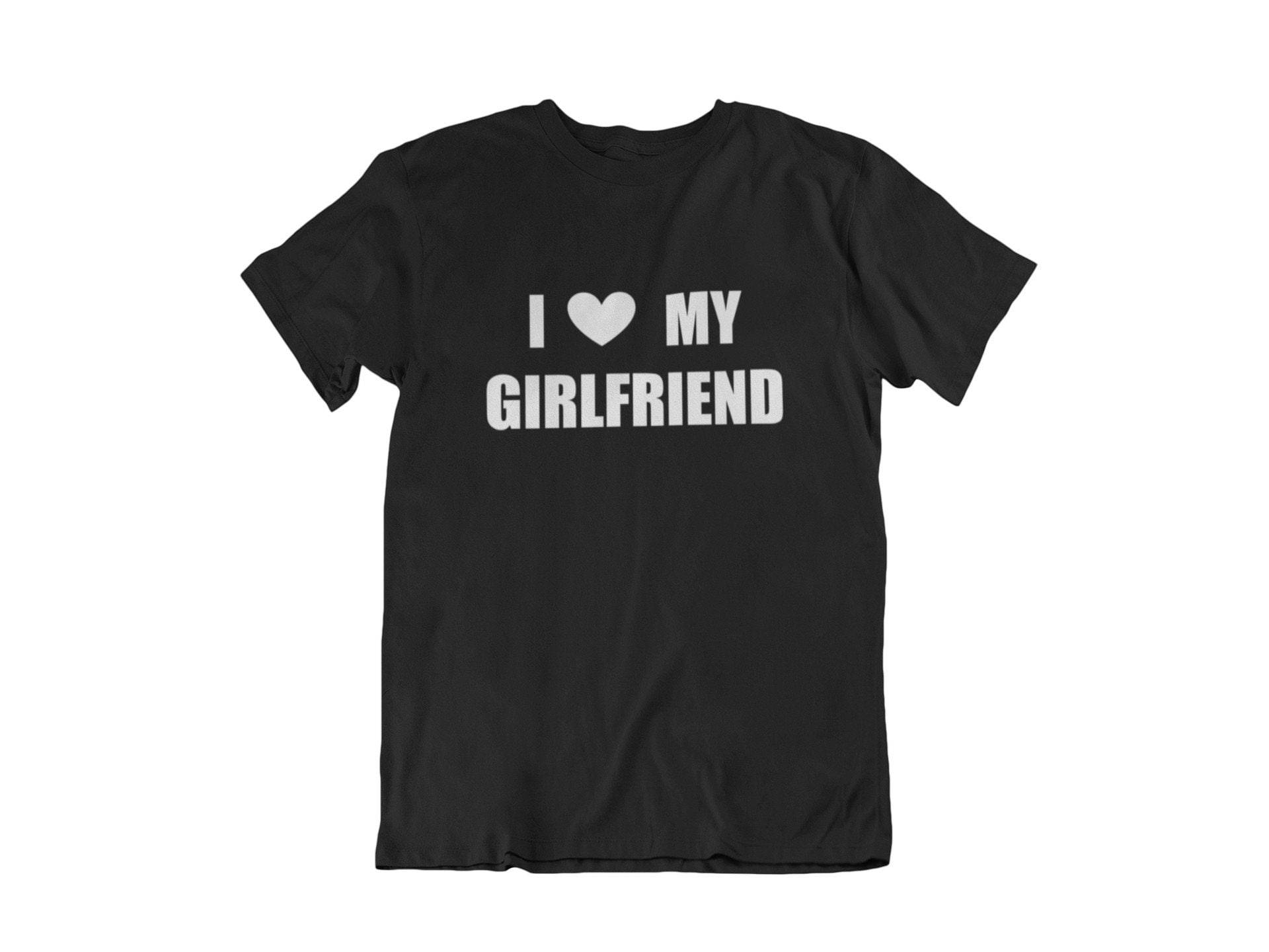 A Man Wearing A Black Shirt With A Loving Declaration To His Girlfriend.