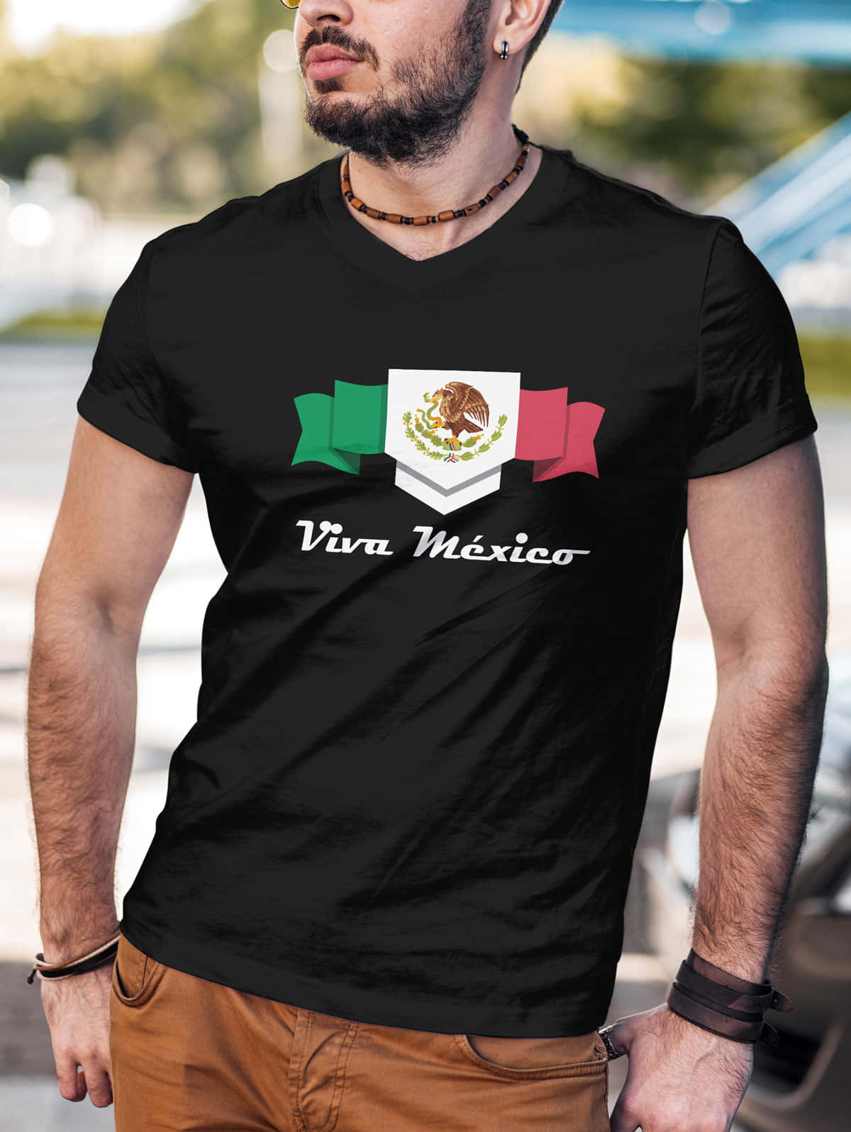 A Man Wearing A Black T - Shirt With The Mexican Flag