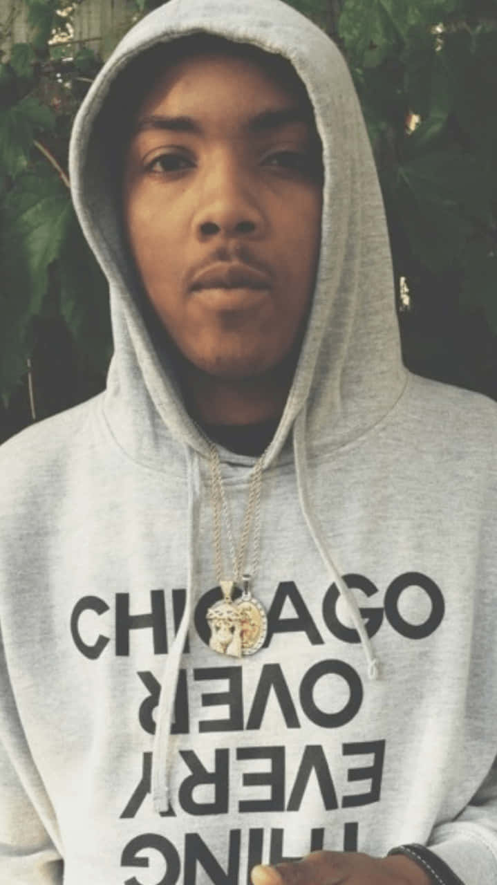 A Man Wearing A Hoodie With The Word Chicago On It