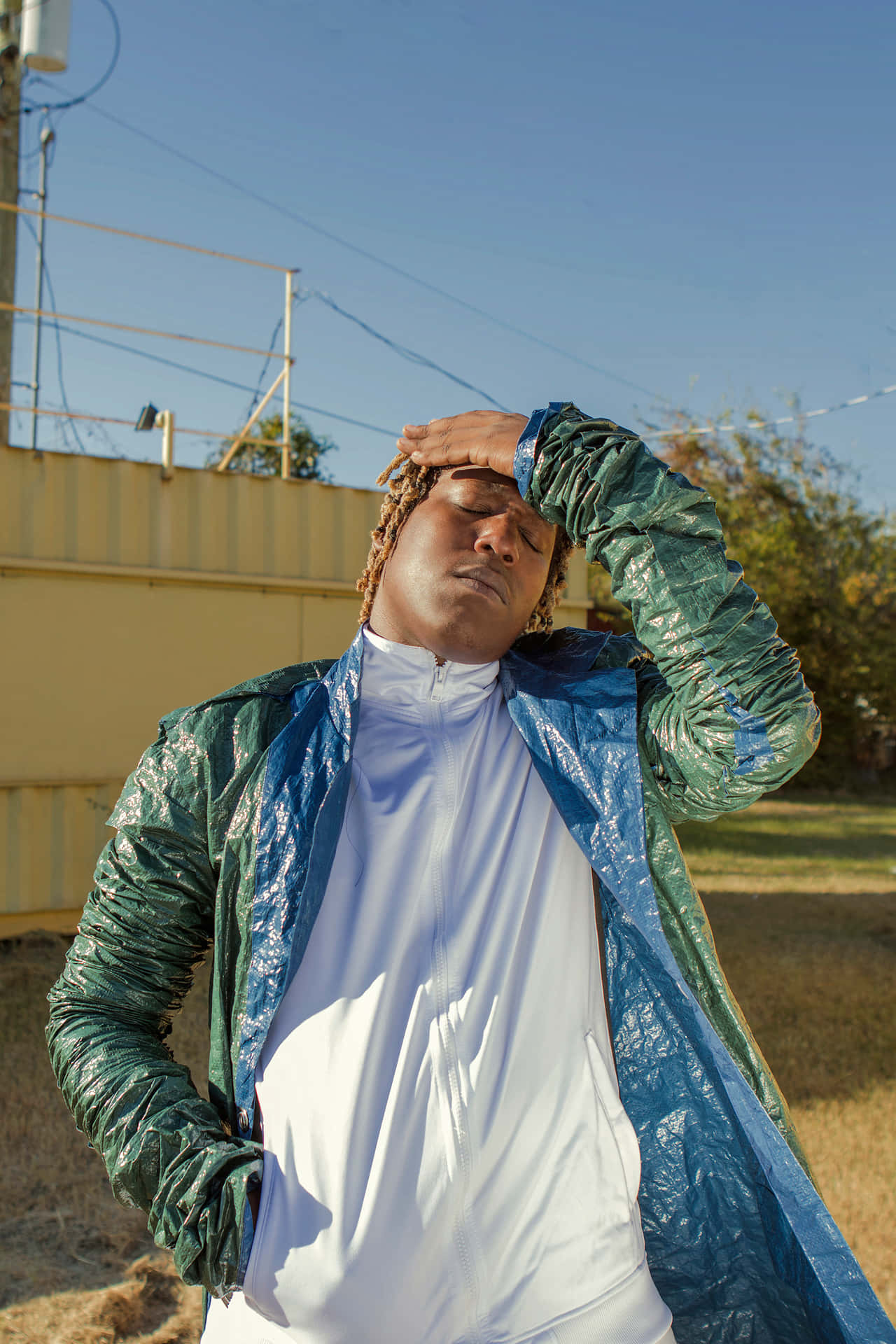 A Man Wearing A Jacket And Hat Background