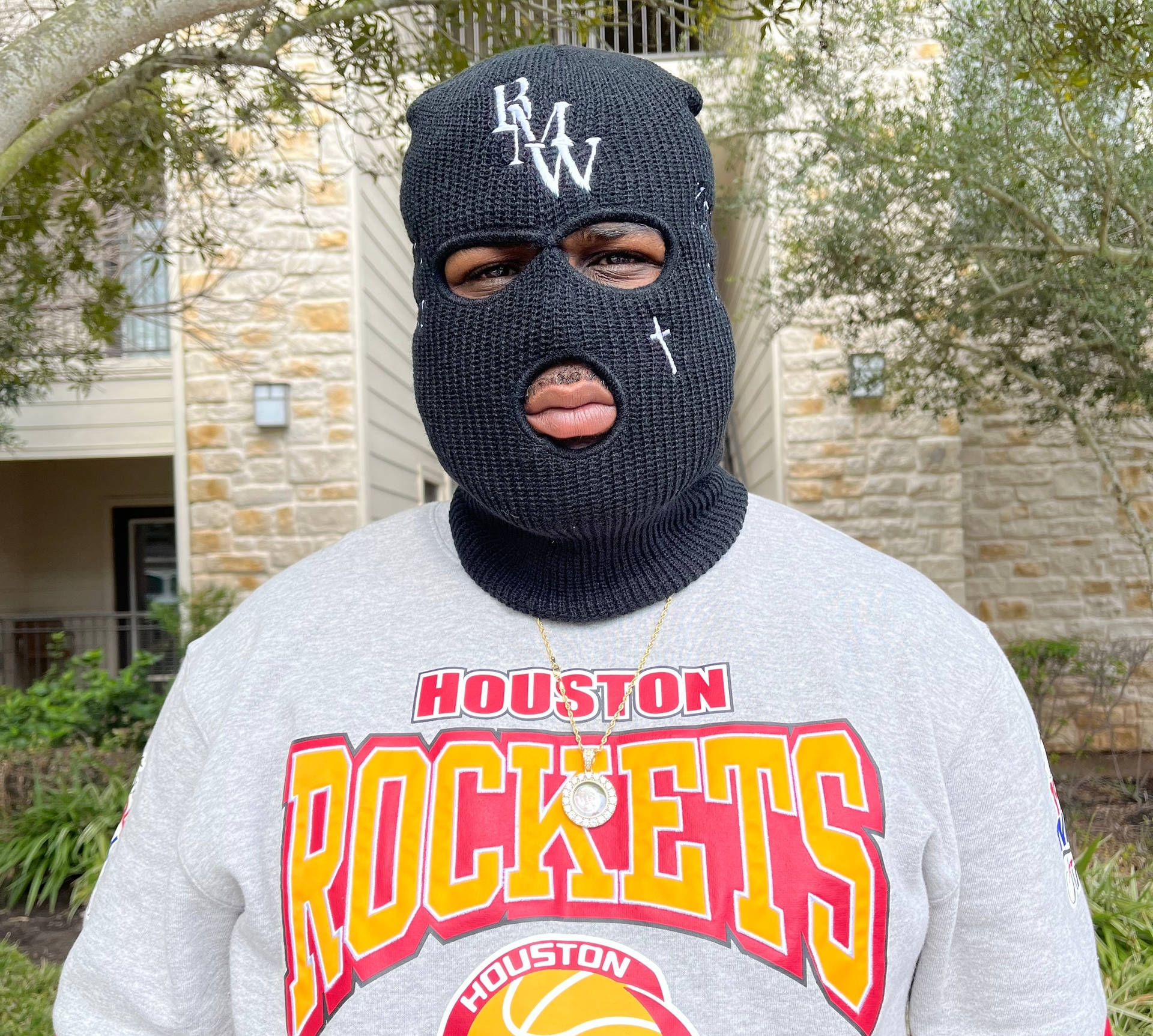 A Man Wearing A Mask Background