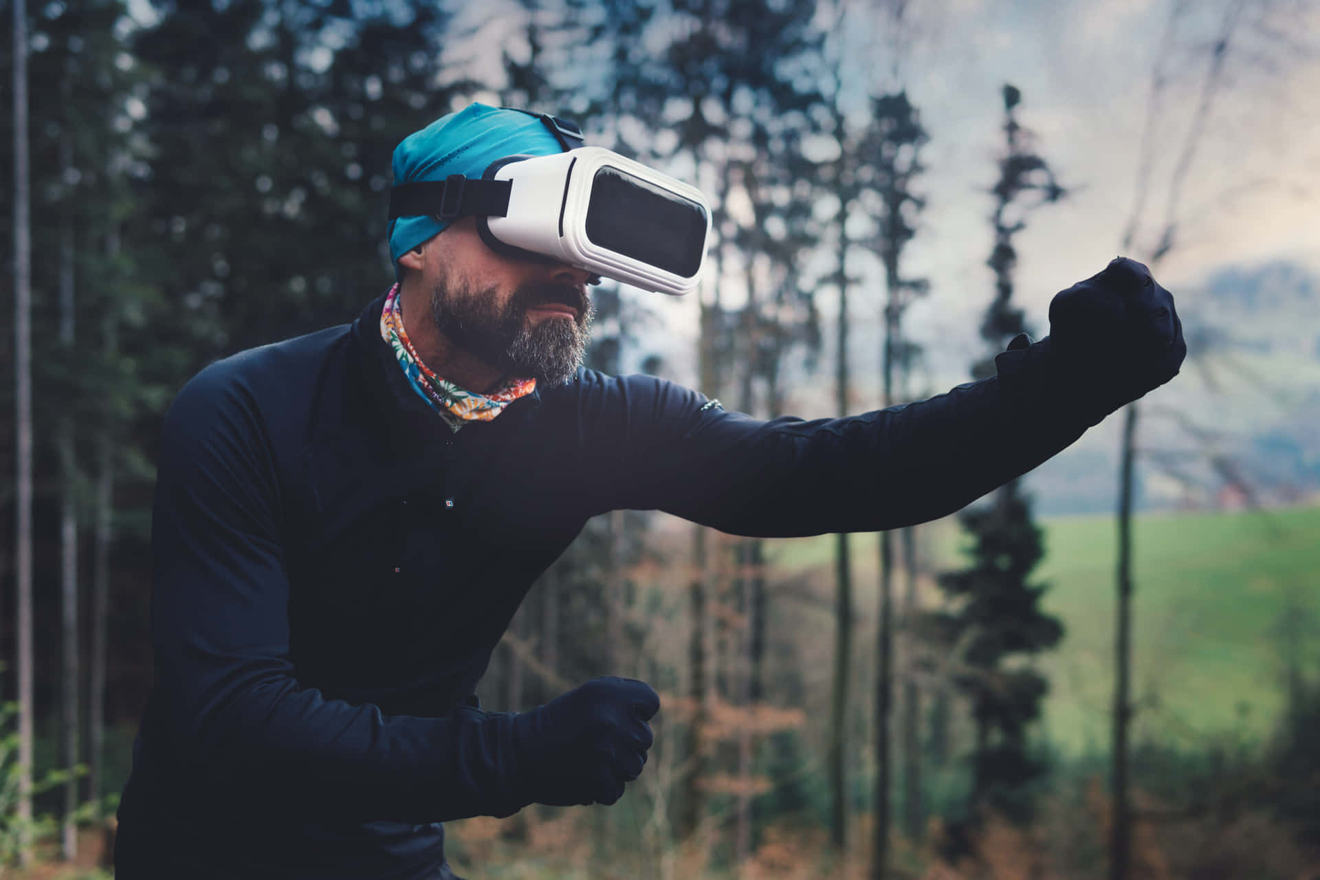 A Man Wearing A Virtual Reality Headset In The Forest Background