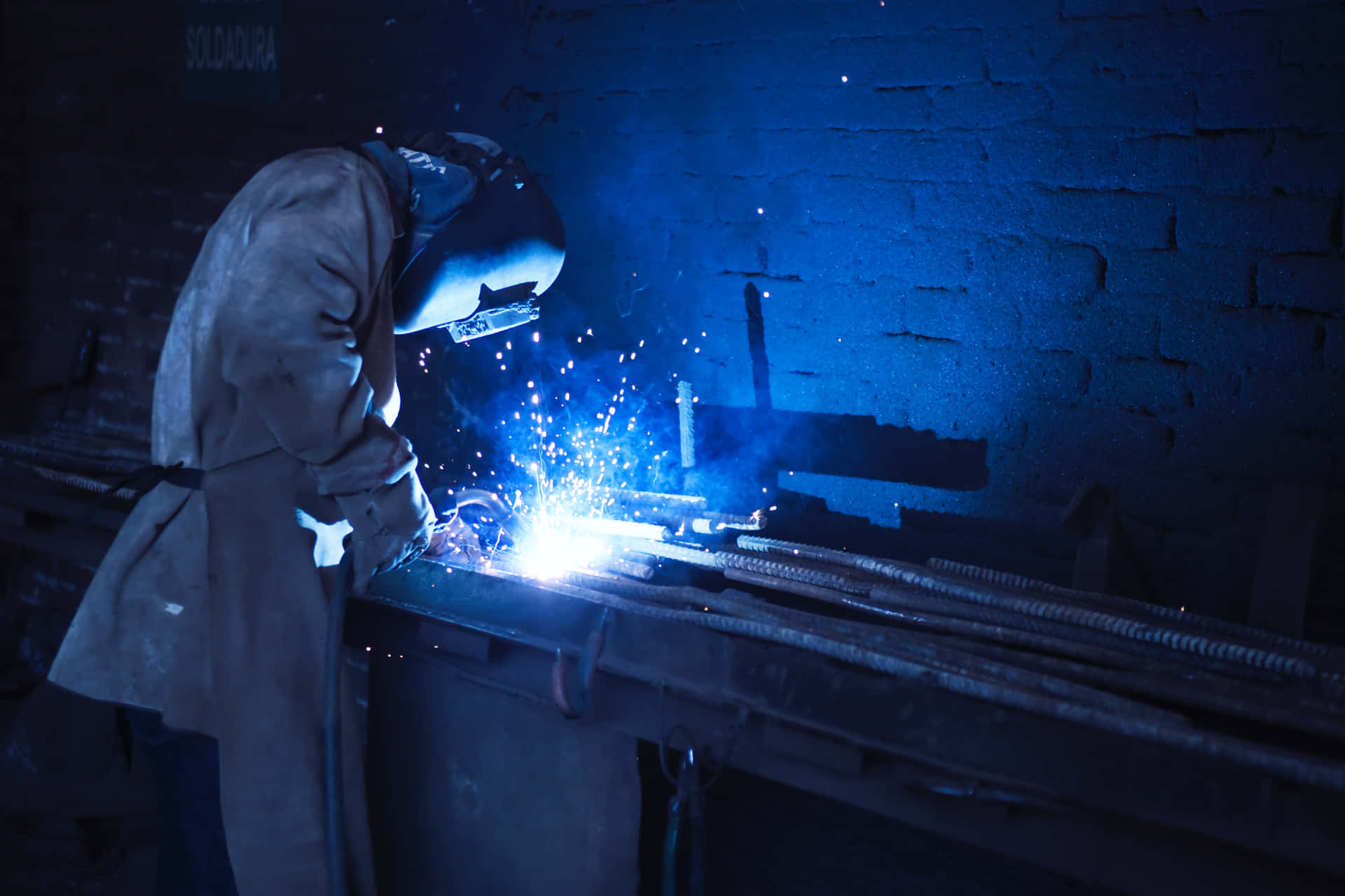 A Man Welding Metal