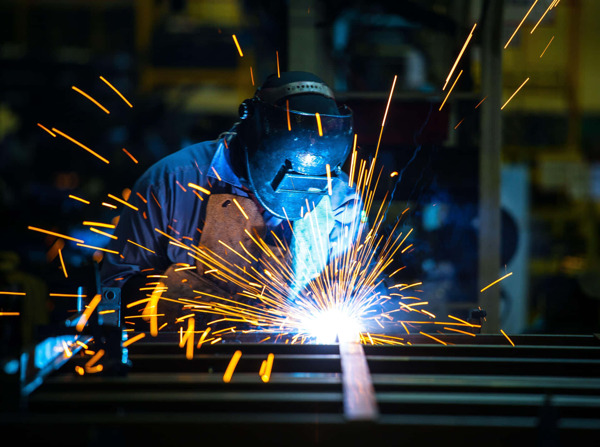 A Man Welding Metal