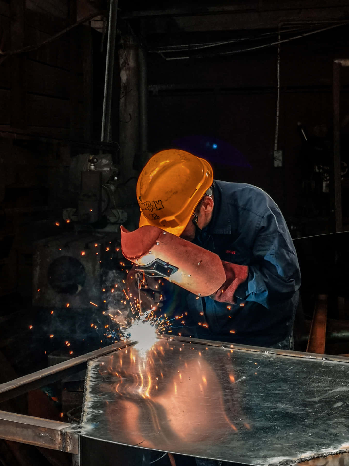 A Man Welding Metal