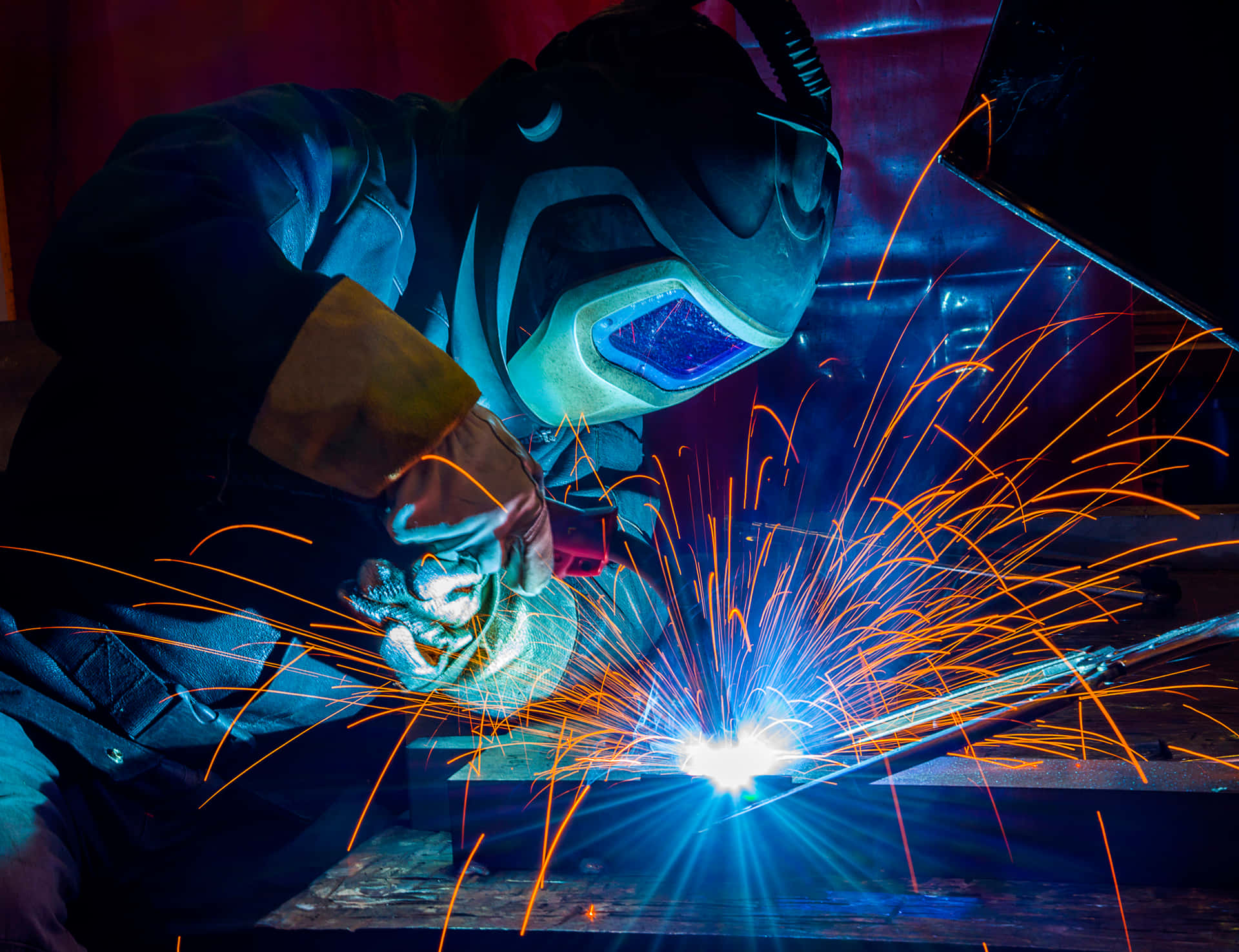 A Man Welding Metal Background