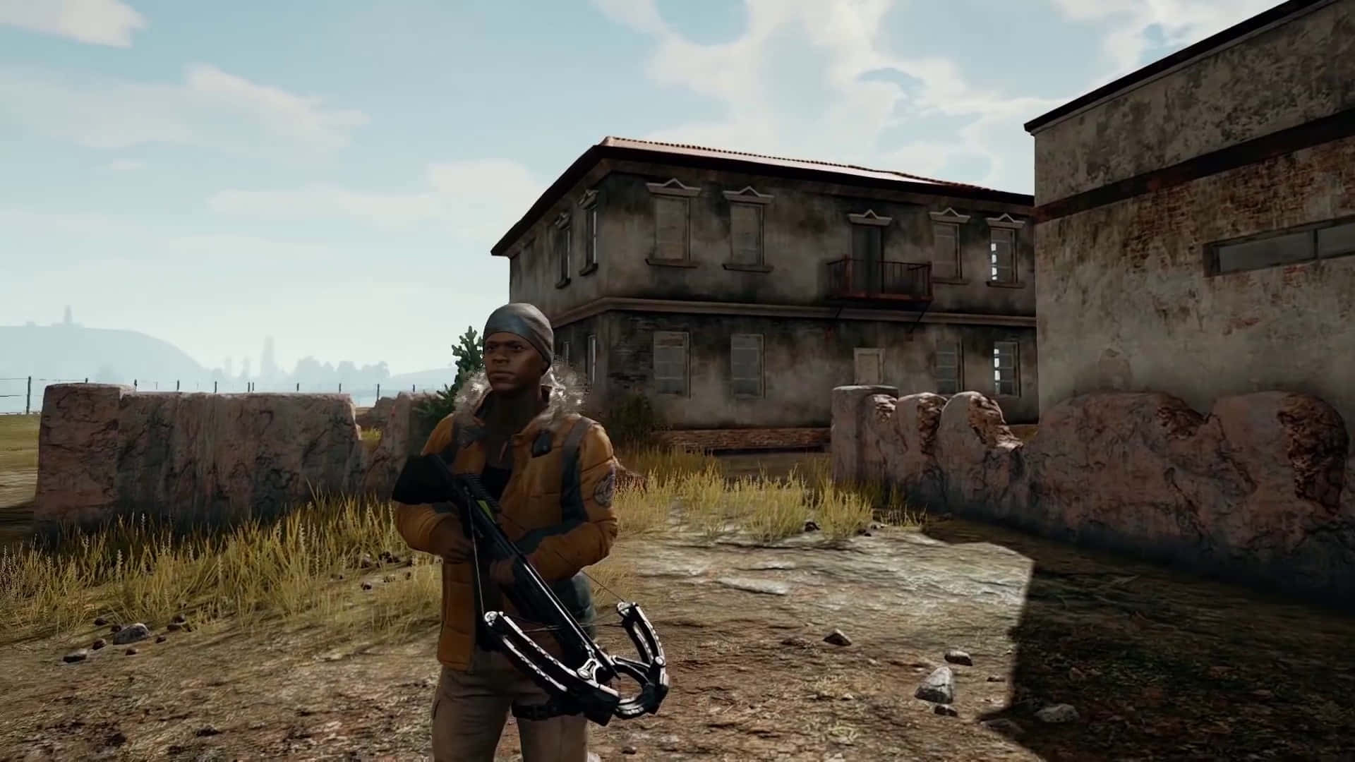 A Man With A Gun Is Standing In Front Of A Building Background