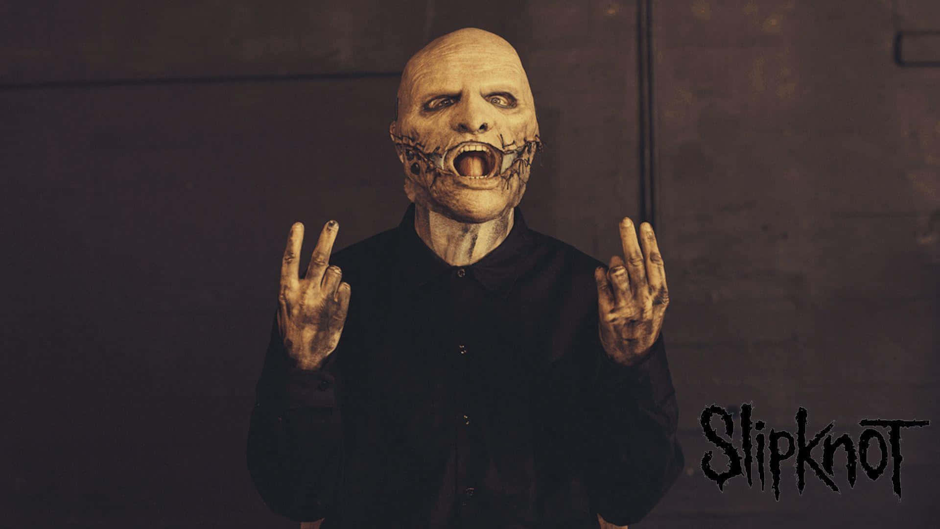 A Man With A Mask On His Face