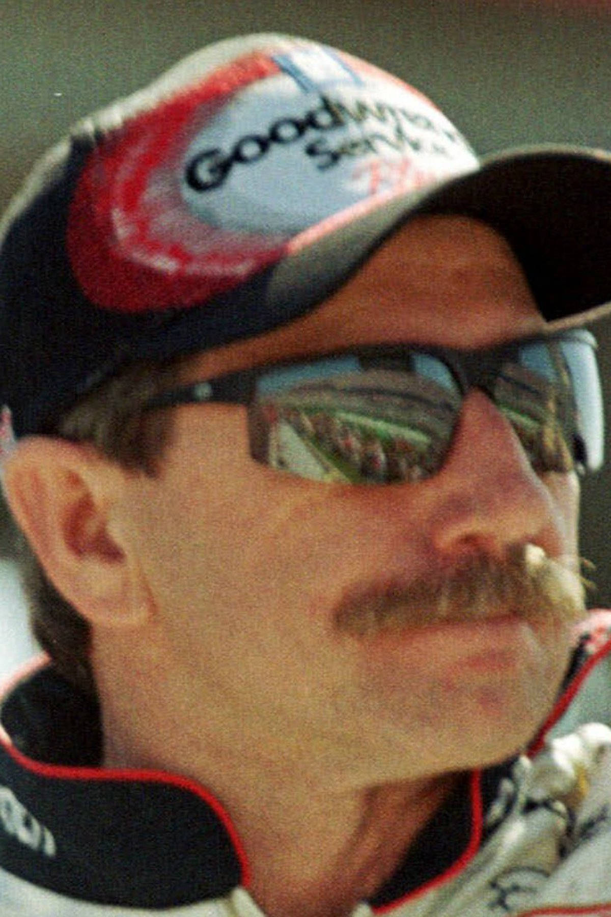 A Man With A Mustache And Sunglasses