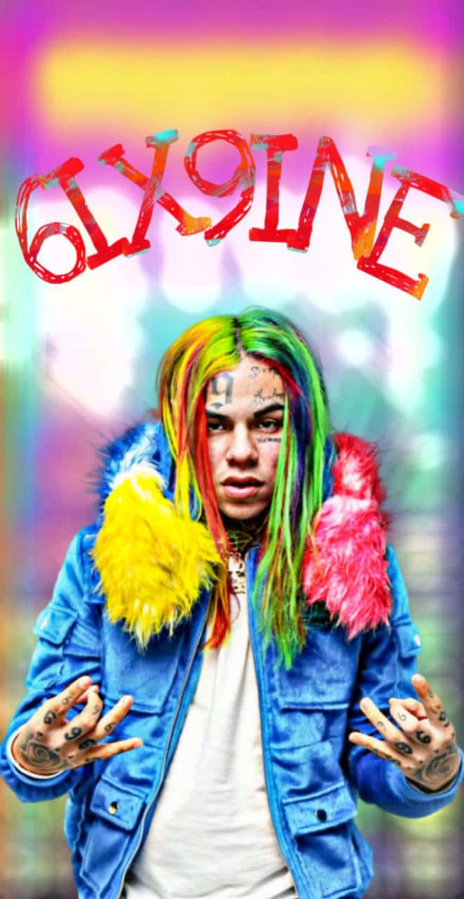 A Man With Colorful Hair And A Rainbow Jacket Background