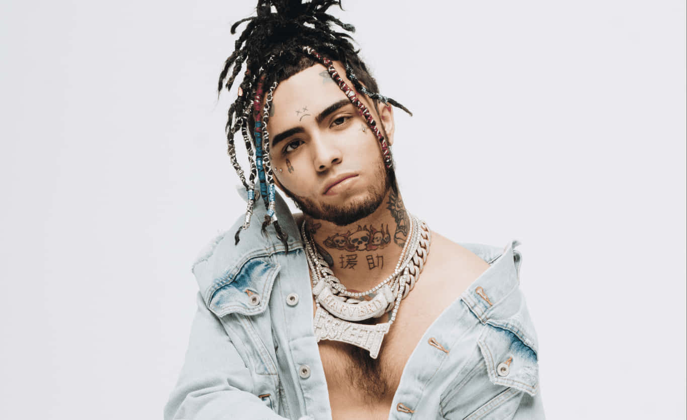 A Man With Dreadlocks And A Necklace Background
