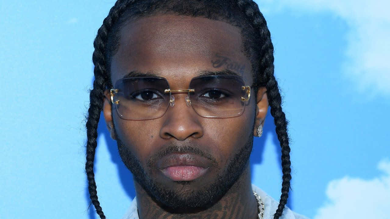 A Man With Glasses And Braids On His Head Background