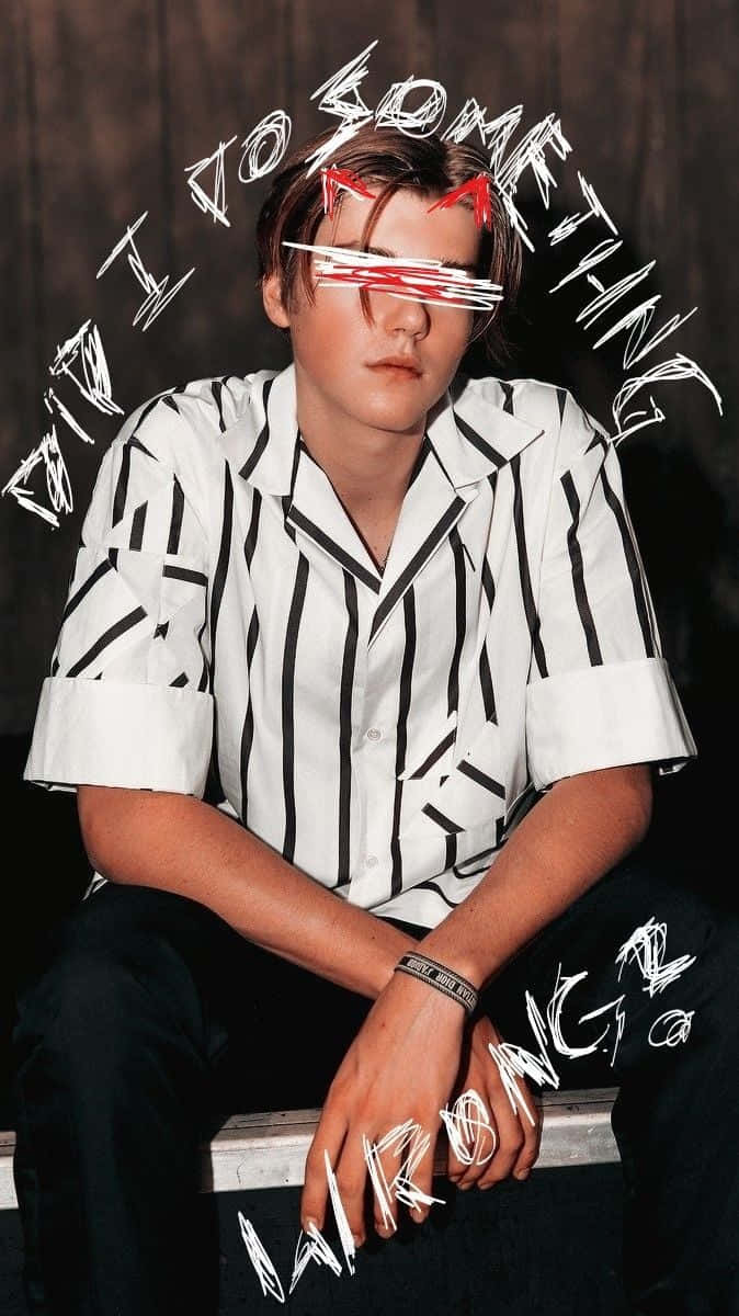 A Man With Glasses Sitting On A Bench Background