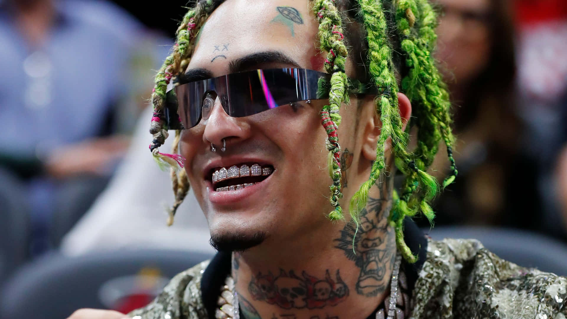 A Man With Green Dreadlocks And Sunglasses Is Smiling Background