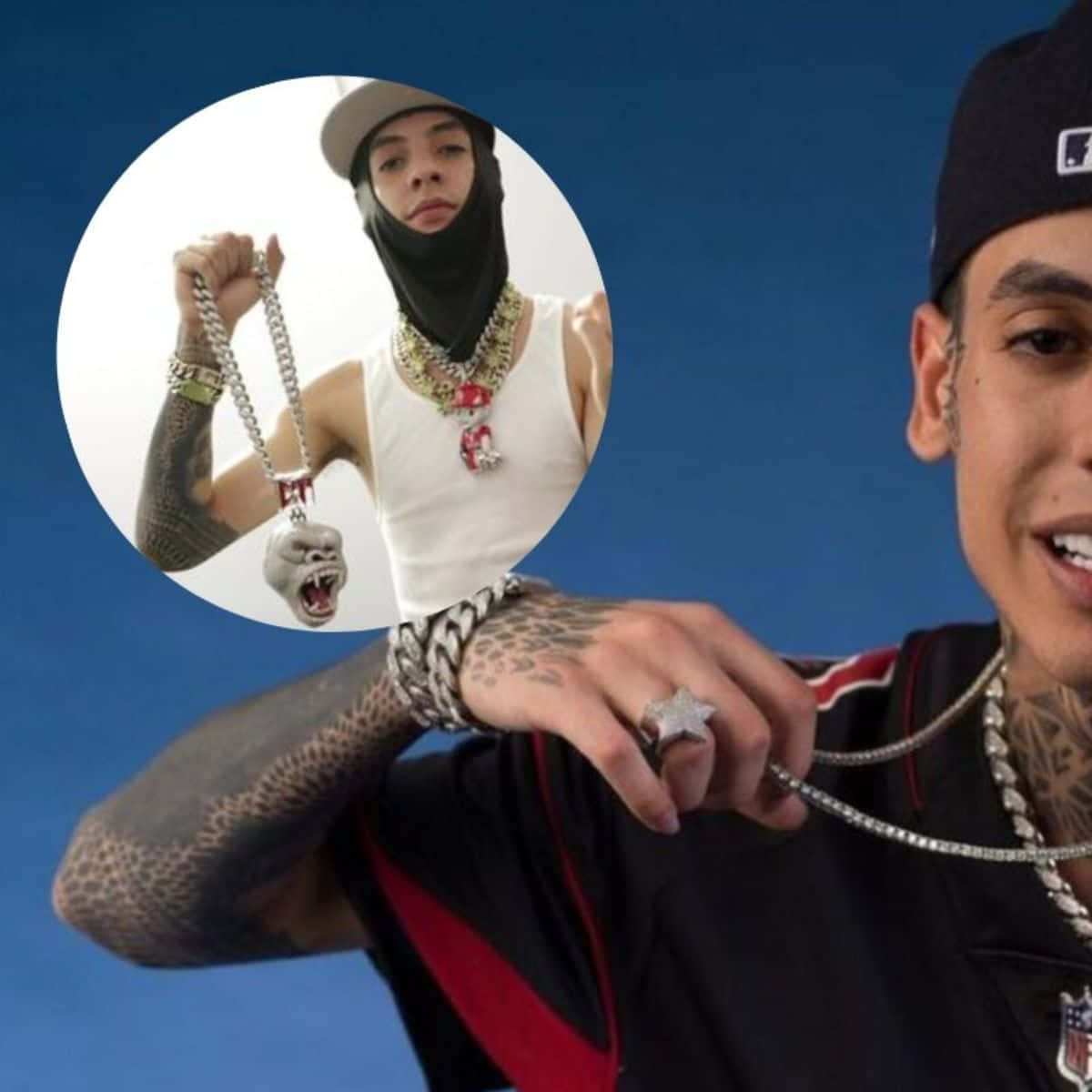 A Man With Tattoos And A Hat Is Holding A Necklace Background