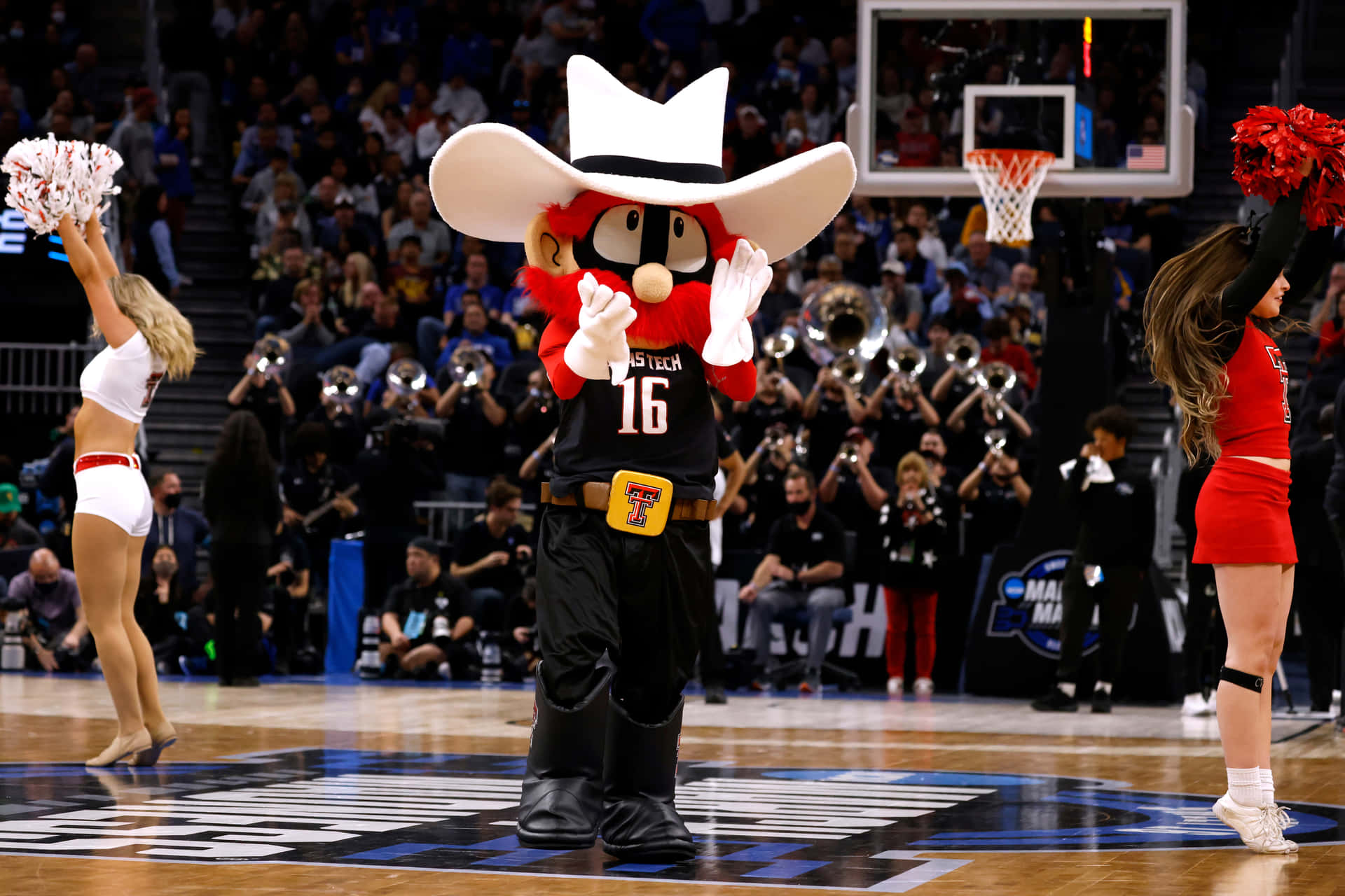 A Mascot Wearing A Cowboy Hat Background