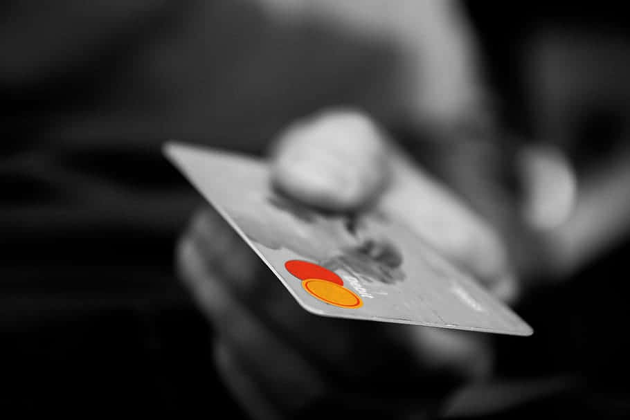 A Mastercard Credit Card In A Modern Environment Background