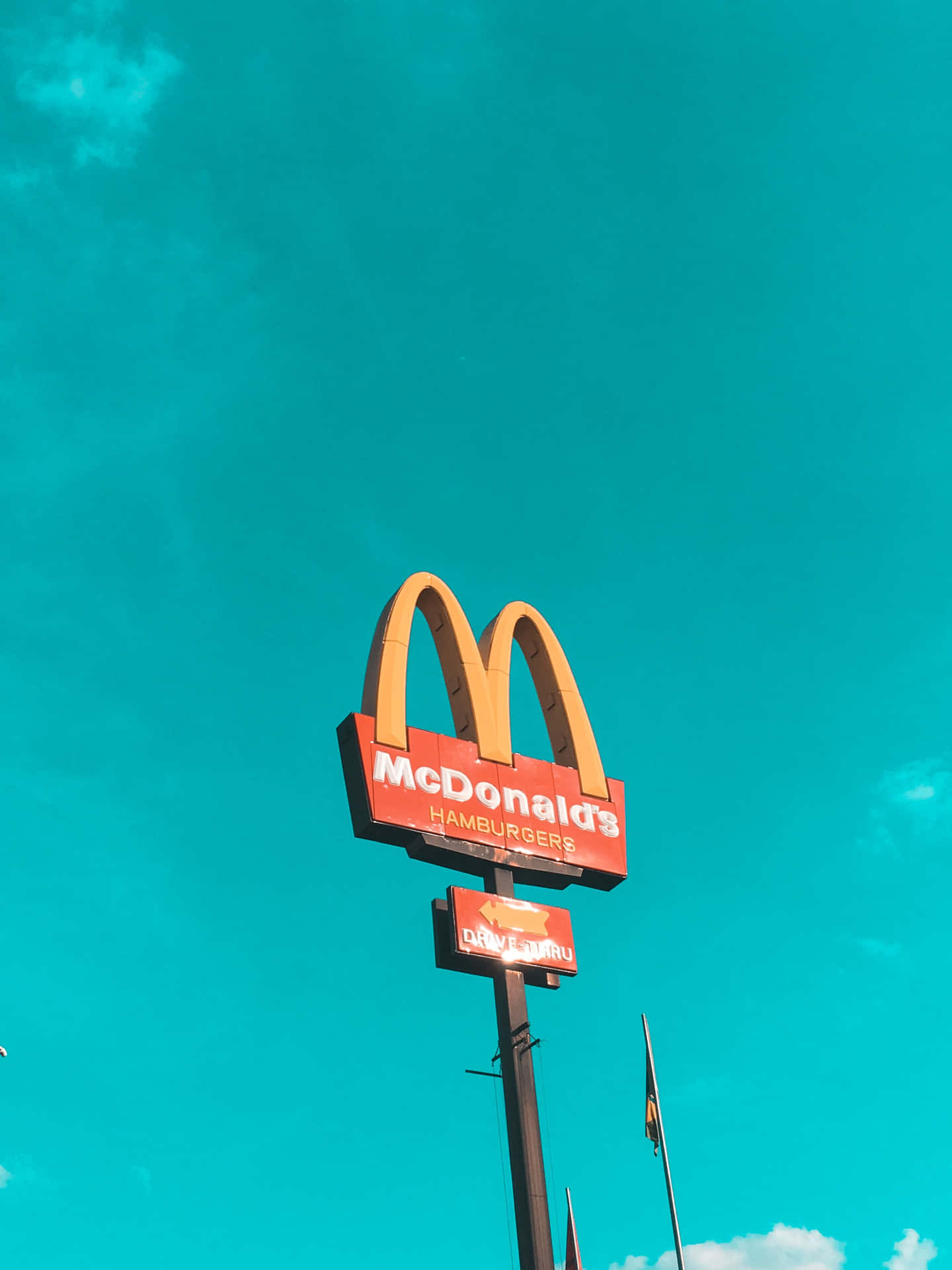 A Mcdonald's Sign In The Sky Background