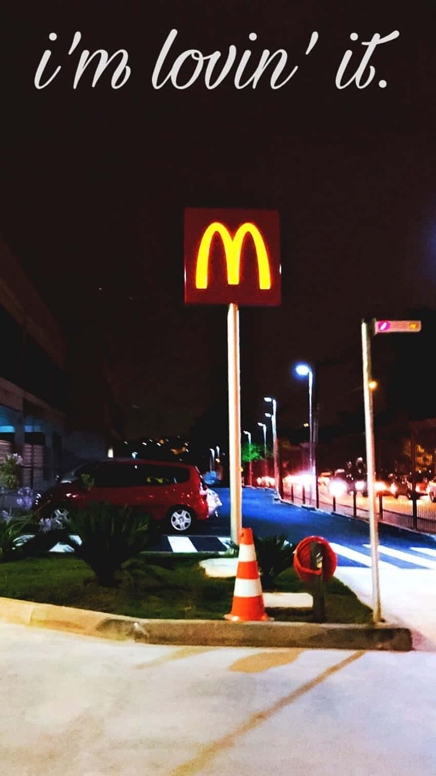 A Mcdonald's Sign With The Words I'm Lovin It Background