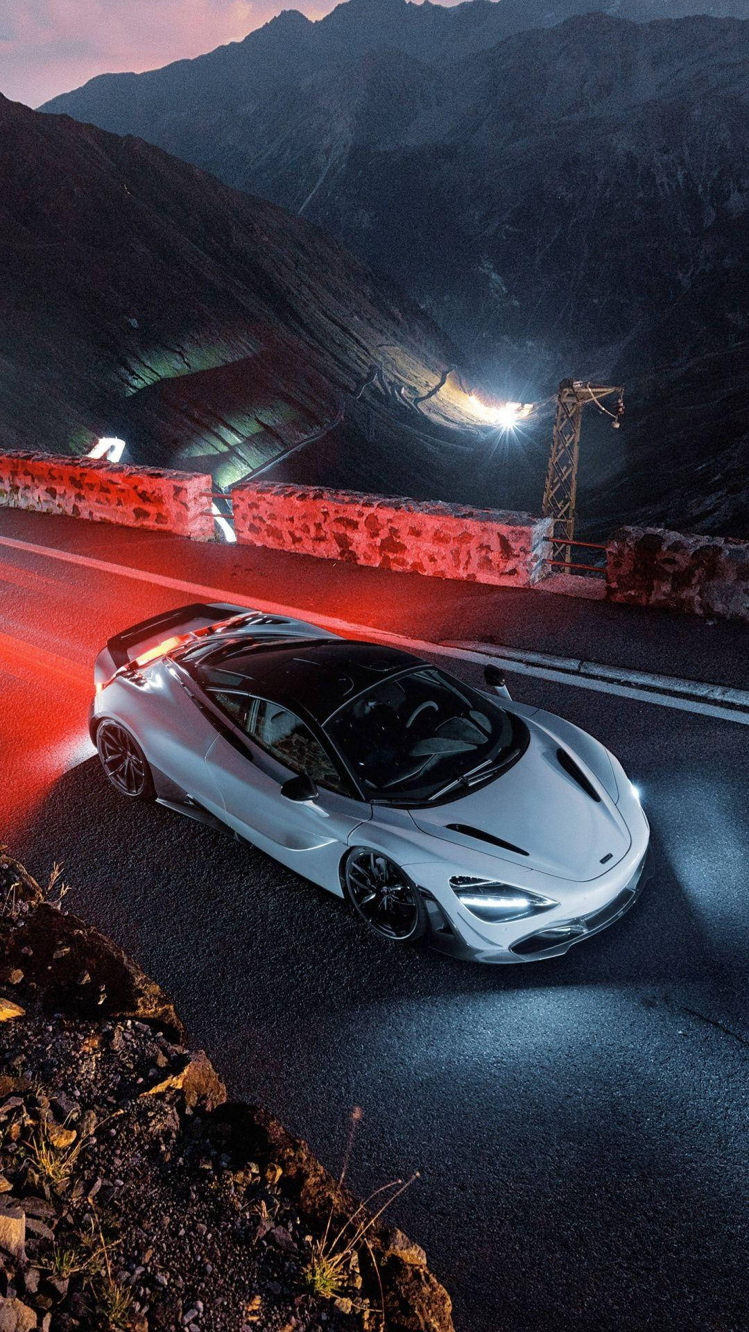 A Mclaren 720s Showcased In All Its Magnificence Under Aesthetic Lighting Background