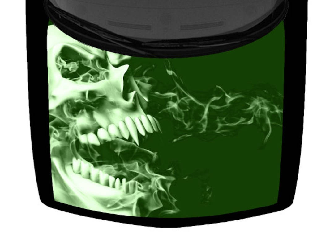 A Menacing Green Skull Sits Atop A Burning Flame Background