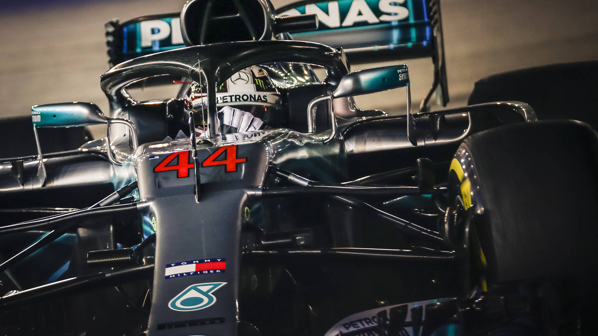 A Mercedes F1 Car With Number 44 On It Background