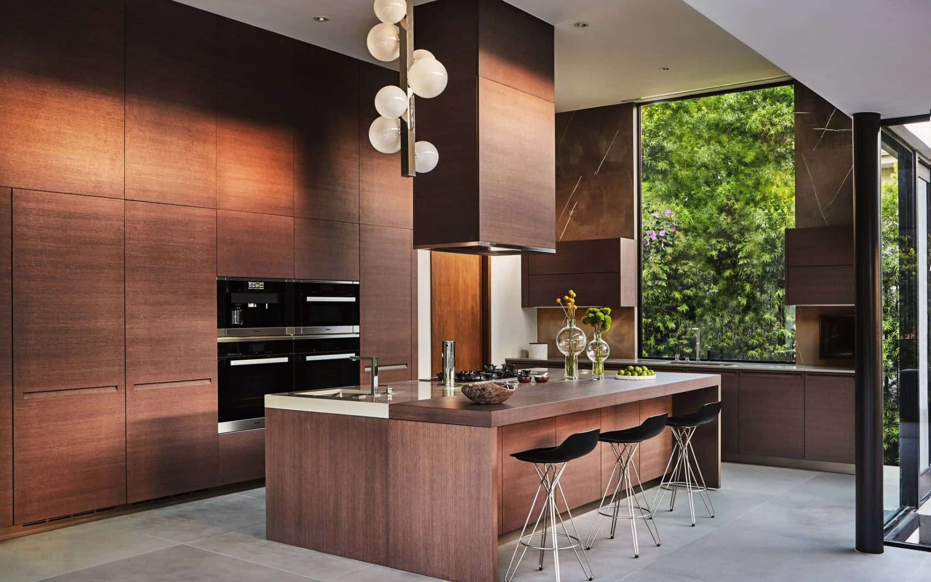 A Modern Kitchen With Wooden Cabinets And A Large Window Background