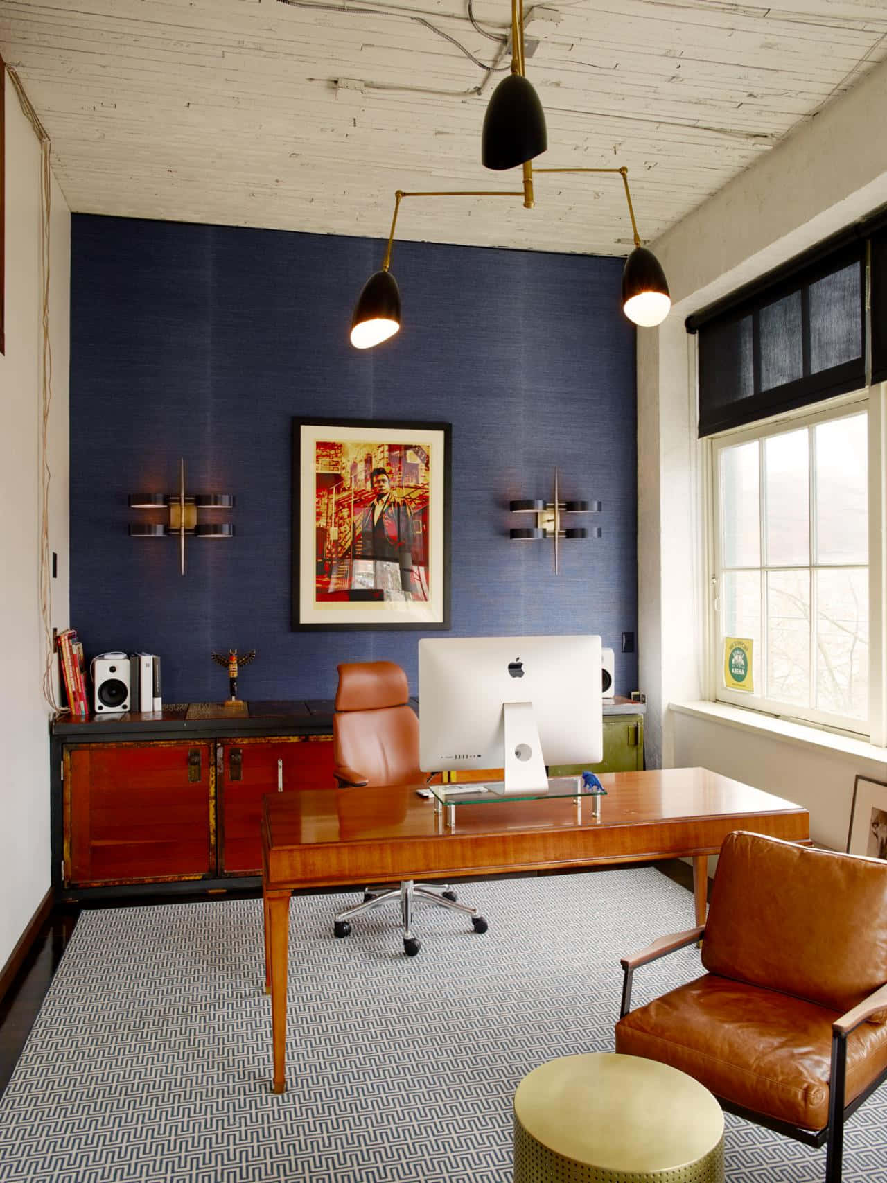 A Modern Office With Blue Walls And A Leather Chair Background