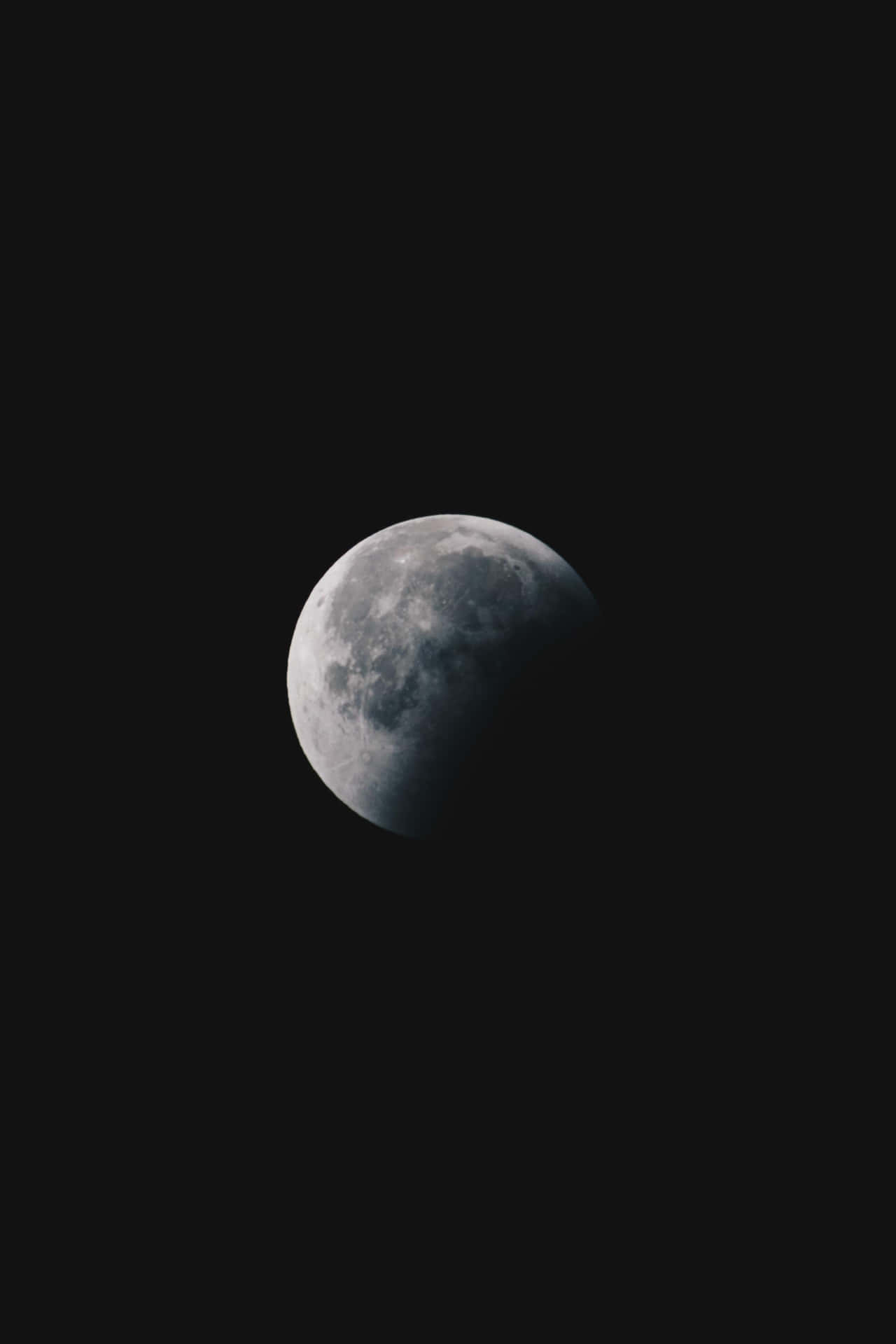 A Moon Is Seen In The Dark Sky Background