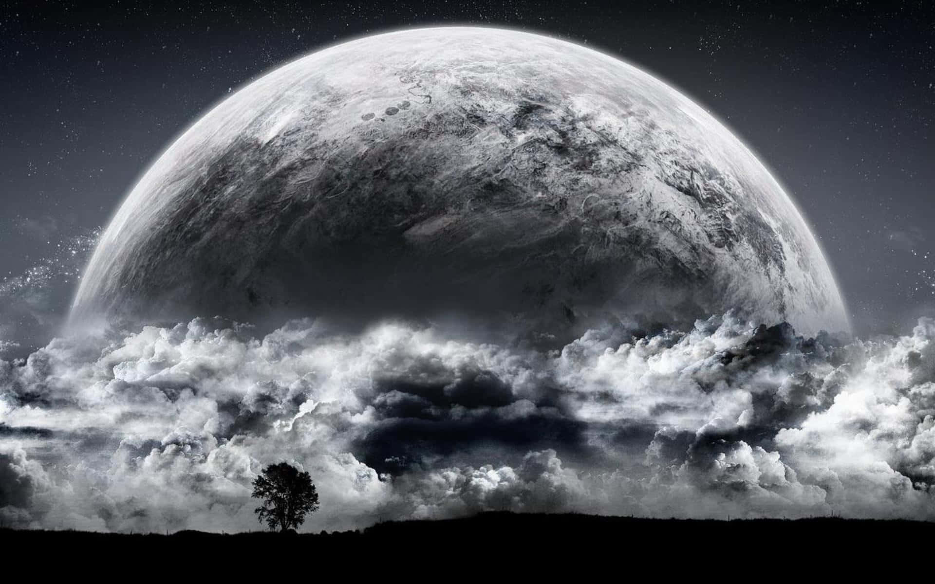 A Moon With Clouds And A Tree In The Background Background