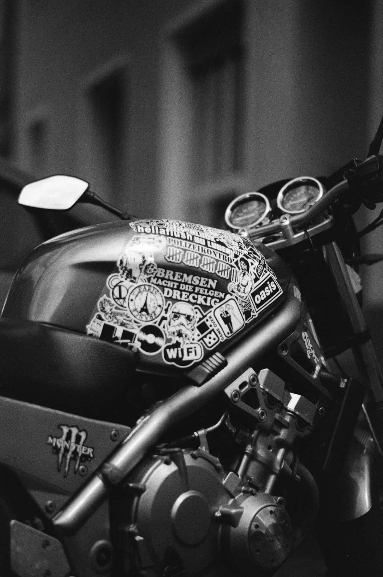A Motorcycle Parked On The Street Background
