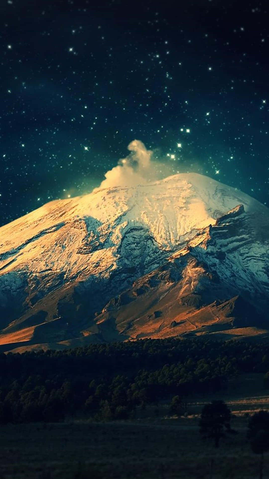 A Mountain Covered In Snow Under The Stars Background