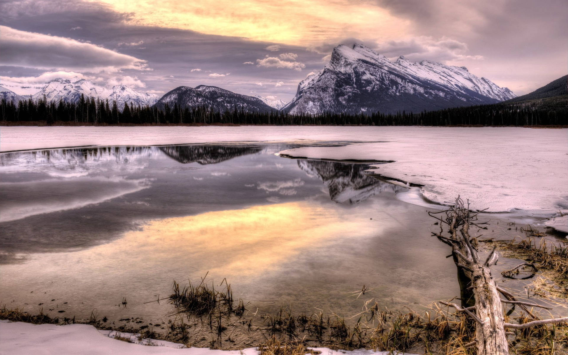 A Mountain Is Reflected In A Lake Background