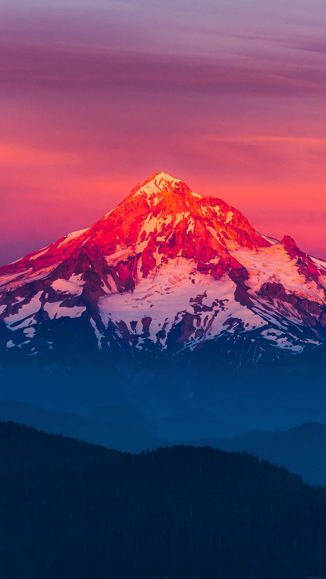 A Mountain Is Seen At Sunset With A Colorful Sky Background