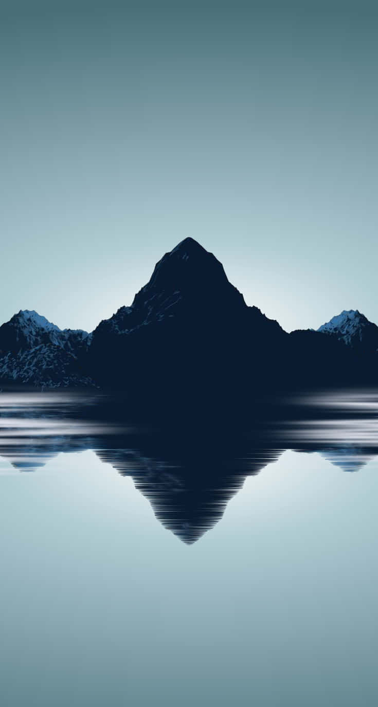 A Mountain Range Is Reflected In The Water Background