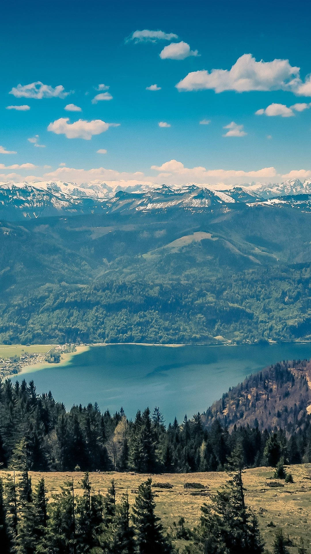 A Mountain Range With A Lake Background