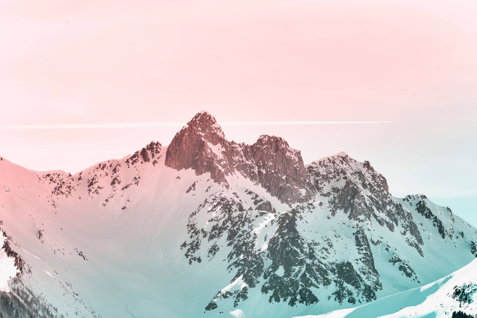 A Mountain Range With A Pink Sky And Snow Background