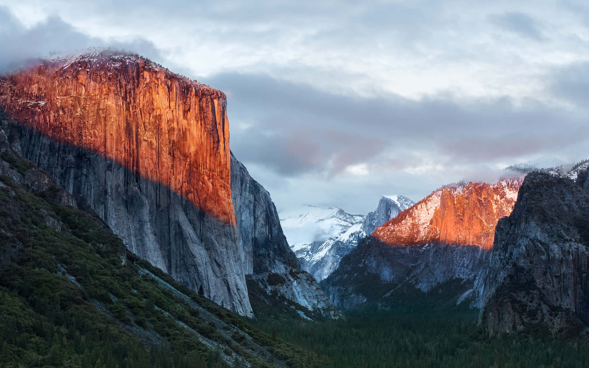 A Mountain Range With A Red Light Shining On It Background