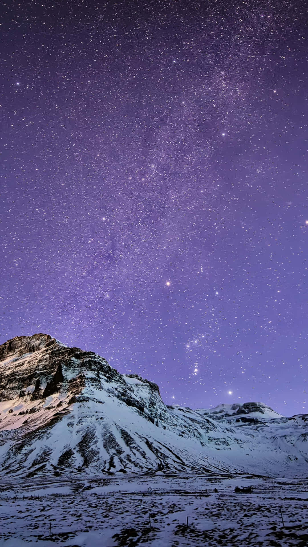 A Mountain With Snow And A Milky Above It Background